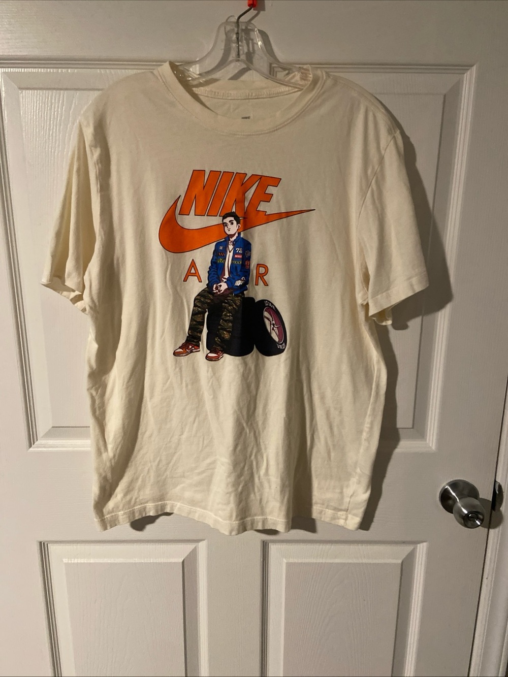 Nike Men’s Cream Short Sleeve Tee with Orange Graphic